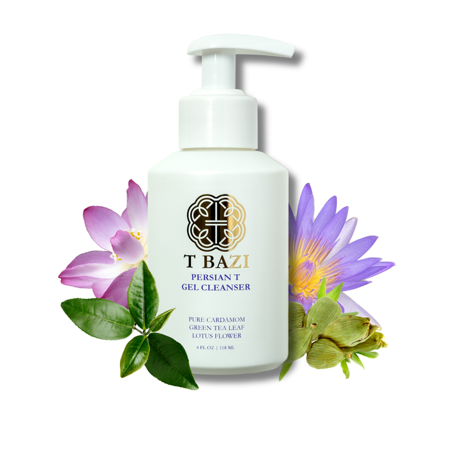 A white pump bottle of T Bazi Persian T Gel Cleanser, surrounded by decorative green tea leaves, a purple lotus flower, and a pink hibiscus flower on a solid white background.