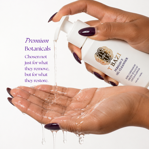 A hand-pumped bottle of I Bazi Permanent and Glycerin Cleanser dispensing clear gel into an open palm, with a second hand holding the bottle. Purple text on the left reads 'Premium Botanicals'.